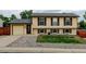 Charming two-story home with attached garage, brick accents, and manicured front yard at 9766 Fillmore St, Thornton, CO 80229