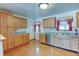 Well-equipped kitchen boasts modern appliances and hardwood floors for easy maintenance at 9766 Fillmore St, Thornton, CO 80229
