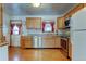 Functional kitchen features wood cabinets, stainless steel appliances, and lots of storage space at 9766 Fillmore St, Thornton, CO 80229