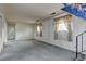 Spacious living room with multiple windows and a stairway at 9766 Fillmore St, Thornton, CO 80229