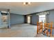 Open living room featuring a staircase, and natural light from the windows at 9766 Fillmore St, Thornton, CO 80229
