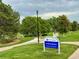 Scenic view of Yorkborough Park with walking paths, green spaces, and mature trees at 9766 Fillmore St, Thornton, CO 80229