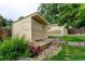Backyard featuring a shed with a brick path and a small garden area with mature vegetation at 9766 Fillmore St, Thornton, CO 80229