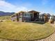 View of the backyard, deck, and home's exterior elevation at 4585 Mesa Top Dr, Monument, CO 80132