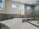 Modern bathroom with a soaking tub, glass shower, and sleek design features at 4585 Mesa Top Dr, Monument, CO 80132