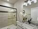 Modern bathroom featuring tile shower, granite countertop, and stylish fixtures at 4585 Mesa Top Dr, Monument, CO 80132