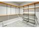 Walk-in closet with custom shelving, hanging rods, and ample storage space at 4585 Mesa Top Dr, Monument, CO 80132