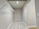 Walk-in closet featuring carpet, shelving, and ample storage space at 4585 Mesa Top Dr, Monument, CO 80132