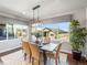 The dining room features a large window, stylish lighting, and space for entertaining at 4585 Mesa Top Dr, Monument, CO 80132
