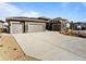 Attractive single-Gathering home featuring three-car garage and spacious concrete driveway at 4585 Mesa Top Dr, Monument, CO 80132