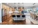 Stylish kitchen with stainless steel appliances, granite countertops, wooden cabinets, and eat-in island at 4585 Mesa Top Dr, Monument, CO 80132