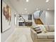 Finished basement living room with a wet bar, stylish decor, and carpet floors at 4585 Mesa Top Dr, Monument, CO 80132