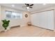 Bright bedroom featuring luxury vinyl plank flooring, window and large closet at 12172 Melody Dr # 102, Denver, CO 80234