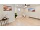 Finished basement area featuring decorative artwork, luxury vinyl plank flooring, and a unique window at 12172 Melody Dr # 102, Denver, CO 80234
