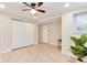 Bedroom with ceiling fan, large closet and luxury vinyl plank flooring at 12172 Melody Dr # 102, Denver, CO 80234