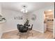 Dining area featuring modern furnishings, stylish decor, and convenient access to the laundry area at 12172 Melody Dr # 102, Denver, CO 80234