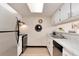 Bright kitchen features stainless steel appliances, marble countertops, skylight and decorative wall hangings at 12172 Melody Dr # 102, Denver, CO 80234