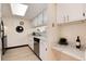 Well-lit kitchen with stainless steel appliances, light countertops, and efficient storage solutions at 12172 Melody Dr # 102, Denver, CO 80234