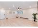 Comfortable and open living room with a window, neutral walls, and seamlessly flowing into other spaces at 12172 Melody Dr # 102, Denver, CO 80234