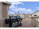 Back deck featuring a large grill, perfect for outdoor cooking and entertaining with a neighborhood view at 6817 Sequoia St, Frederick, CO 80530