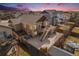 Aerial view of a backyard with a patio, hot tub, shed, and a well-maintained fence for privacy at 6817 Sequoia St, Frederick, CO 80530