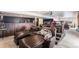 Finished basement featuring a bar, tiered seating, and a home theater setup for entertainment at 6817 Sequoia St, Frederick, CO 80530