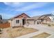 Attractive single Gathering home boasting a 3-car garage and well-manicured lawn at 6817 Sequoia St, Frederick, CO 80530