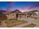 Beautifully landscaped home with a two-car garage and inviting entrance featuring a meticulously kept front yard at 6817 Sequoia St, Frederick, CO 80530