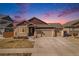 Charming home boasts a three-car garage, stone accents, and neutral siding under a twilight sky at 6817 Sequoia St, Frederick, CO 80530