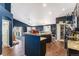 Modern kitchen featuring granite countertops, dark wood cabinetry, and stainless steel appliances at 6817 Sequoia St, Frederick, CO 80530