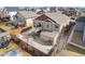 Expansive concrete patio and deck with staircase offer inviting outdoor living and entertaining spaces in this well-fenced backyard at 6817 Sequoia St, Frederick, CO 80530