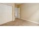 Bedroom with neutral carpet, and closet at 9215 W Swarthmore Dr, Littleton, CO 80123