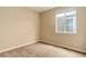 Bedroom with neutral carpet, and a window providing natural light at 9215 W Swarthmore Dr, Littleton, CO 80123