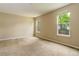 Bright bedroom with large windows and neutral carpet and paint at 9215 W Swarthmore Dr, Littleton, CO 80123