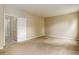 Large bedroom with neutral carpet and paint, perfect for relaxation and comfort at 9215 W Swarthmore Dr, Littleton, CO 80123