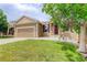 Charming single-Gathering home with a well-manicured lawn and attached two-car garage at 9215 W Swarthmore Dr, Littleton, CO 80123