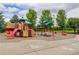 Community playground with climbing structure, slide and room to roam at 9215 W Swarthmore Dr, Littleton, CO 80123