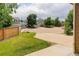 A quiet neighborhood street features well-kept homes and mature trees, showcasing community charm at 9215 W Swarthmore Dr, Littleton, CO 80123