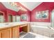 Spacious primary bathroom with large mirror, tub, shower, and double vanity at 16222 E Prentice Ln, Centennial, CO 80015
