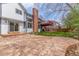 Back of home featuring large patio, deck, chimney, and glass sliding doors at 16222 E Prentice Ln, Centennial, CO 80015