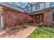 Inviting walkway leading to the front door with decorative landscaping and a cozy bench at 16222 E Prentice Ln, Centennial, CO 80015