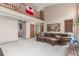 Open-concept living room with high ceilings and a view of the second-floor loft at 16222 E Prentice Ln, Centennial, CO 80015