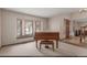 Living room features a large window, plush carpet, and ample natural lighting at 16222 E Prentice Ln, Centennial, CO 80015