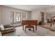 Bright living room with bay windows, a window seat, and comfortable seating at 16222 E Prentice Ln, Centennial, CO 80015