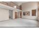 Open-concept living room with soaring ceilings, a cozy reading nook, and an eat-in kitchen at 16222 E Prentice Ln, Centennial, CO 80015