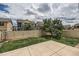 Fenced backyard with lawn and concrete patio, perfect for outdoor relaxation and entertaining at 4414 Walden St, Denver, CO 80249