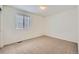 Bedroom featuring neutral carpet and a window offering natural light at 4414 Walden St, Denver, CO 80249