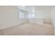 Spacious bedroom featuring neutral carpet, a window with blinds, and ample natural light at 4414 Walden St, Denver, CO 80249
