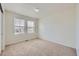 Well-lit bedroom with neutral carpet and windows offering natural light at 4414 Walden St, Denver, CO 80249