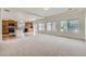 Open concept design featuring a carpeted living space and an eat-in kitchen area, perfect for entertaining at 4414 Walden St, Denver, CO 80249